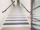 Elegant staircase featuring modern railings and hardwood steps at 608 S Evelyn Nw Pl, Atlanta, GA 30318