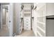 Organized walk-in closet with custom shelving, drawers, and ample storage space for clothing and accessories at 608 S Evelyn Nw Pl, Atlanta, GA 30318