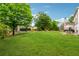 Large backyard with a trampoline and outdoor seating area, perfect for entertaining at 7545 Brookwood Way, Cumming, GA 30041