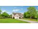 Side view of a well maintained home with lush landscaping, and a basketball hoop at 7545 Brookwood Way, Cumming, GA 30041