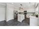 This kitchen features white cabinets, stainless steel appliances, and a center island at 7545 Brookwood Way, Cumming, GA 30041