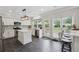 Modern kitchen featuring stainless steel appliances, a center island, and light countertops at 7545 Brookwood Way, Cumming, GA 30041