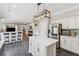 Bright kitchen with stainless steel appliances, an island, and an open view to living area at 7545 Brookwood Way, Cumming, GA 30041