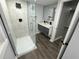 Modern bathroom with a sleek glass shower and dual sink vanity at 2040 Penelope Nw St, Atlanta, GA 30314