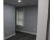Bright bedroom features modern gray paint and a window providing natural light at 2040 Penelope Nw St, Atlanta, GA 30314