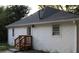 Back exterior of home with white brick and new wooden stairs at 2040 Penelope Nw St, Atlanta, GA 30314