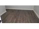 Elegant room featuring laminate wood floors, neutral walls, and white trim for a sleek and modern design at 2040 Penelope Nw St, Atlanta, GA 30314