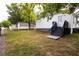 Spacious backyard with lush lawn, white picket fence and nice back porch, perfect for outdoor enjoyment at 27 Hazel St, Porterdale, GA 30014