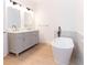 Bright bathroom with a modern soaking tub and double sink vanity at 27 Hazel St, Porterdale, GA 30014