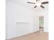 Bright and spacious bedroom showcasing hardwood floors and a ceiling fan at 27 Hazel St, Porterdale, GA 30014