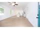 Open-concept living space showcasing light wood floors and an airy ambiance at 27 Hazel St, Porterdale, GA 30014
