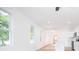Bright and airy living area with hardwood floors and modern, white accents at 27 Hazel St, Porterdale, GA 30014