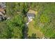 Home surrounded by dense trees, and winding driveway in a wooded setting at 552 Steels Bridge Rd, Canton, GA 30114