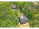 Scenic aerial shot of a property with a long driveway, surrounded by verdant trees, offering privacy and tranquility at 552 Steels Bridge Rd, Canton, GA 30114