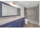 Bathroom featuring vanity with marble countertop and a glass shower at 552 Steels Bridge Rd, Canton, GA 30114
