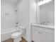 A clean, modern bathroom with white subway tiles, new toilet, vanity, and updated fixtures at 552 Steels Bridge Rd, Canton, GA 30114