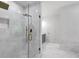 Bathroom featuring a marble shower with brass hardware and gray vanity at 552 Steels Bridge Rd, Canton, GA 30114
