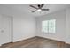 Bedroom with hardwood floors, ceiling fan, and a window at 552 Steels Bridge Rd, Canton, GA 30114