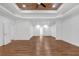 Spacious bedroom featuring hardwood floors and tray ceiling with ceiling fan at 552 Steels Bridge Rd, Canton, GA 30114