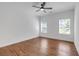 A bright, airy bedroom featuring hardwood floors, neutral paint colors, and plenty of natural light at 552 Steels Bridge Rd, Canton, GA 30114