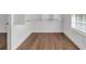 Walk-in closet with shelving, a window, and hardwood floors at 552 Steels Bridge Rd, Canton, GA 30114