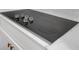 Modern cooktop with black finish and chrome dials at 552 Steels Bridge Rd, Canton, GA 30114