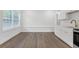 Eat-in kitchen with new white cabinets and countertops and natural light at 552 Steels Bridge Rd, Canton, GA 30114