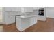 Modern white kitchen features island, stainless appliances, and subway tile backsplash at 552 Steels Bridge Rd, Canton, GA 30114