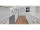 Contemporary kitchen features white cabinets, wine cooler and quartz countertops at 552 Steels Bridge Rd, Canton, GA 30114