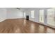 Large living room with hardwood floors and a fireplace at 552 Steels Bridge Rd, Canton, GA 30114