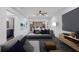 Stylish living room with modern furniture, open layout, seamlessly connects to a dining area and updated kitchen at 552 Steels Bridge Rd, Canton, GA 30114