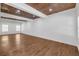 Open-concept living room with hardwood floors and wood-look ceiling at 552 Steels Bridge Rd, Canton, GA 30114