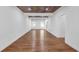 Spacious open-concept living room with windows and wood-look ceiling at 552 Steels Bridge Rd, Canton, GA 30114