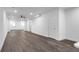 Expansive living room with wood-look floors, white walls and recessed lighting at 552 Steels Bridge Rd, Canton, GA 30114