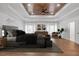 Elegant primary bedroom with wood plank tray ceiling, hardwood floors, and neutral decor for a peaceful retreat at 552 Steels Bridge Rd, Canton, GA 30114