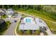 Aerial view showcasing the community pool, clubhouse, parking, and green spaces within a well-planned neighborhood at 6775 Pippin Walk, Alpharetta, GA 30005