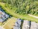 Aerial view of community walking trail between homes and wooded area at 6775 Pippin Walk, Alpharetta, GA 30005