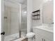Modern bathroom featuring a glass-enclosed shower, floating shelves, and a stylish vanity at 6775 Pippin Walk, Alpharetta, GA 30005
