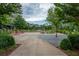 Relaxing community gathering spot with picnic tables and Adirondack chairs amidst greenery and shady trees at 6775 Pippin Walk, Alpharetta, GA 30005