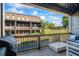 Relaxing deck area overlooking a scenic view with a grill, outdoor seating and string lights at 6775 Pippin Walk, Alpharetta, GA 30005