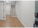 Foyer with beautiful hardwood floors, leading to the staircase and other rooms at 6775 Pippin Walk, Alpharetta, GA 30005