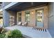 Inviting front porch with chairs, decorative touches, and a stylish entrance door at 6775 Pippin Walk, Alpharetta, GA 30005