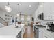 Spacious kitchen featuring a large island, stainless appliances, and an open view of the living area at 6775 Pippin Walk, Alpharetta, GA 30005