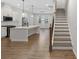 Bright, modern kitchen featuring white cabinets, stainless steel appliances, and an expansive island at 6775 Pippin Walk, Alpharetta, GA 30005
