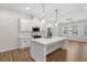 Modern kitchen featuring stainless steel appliances, a large island, and ample counter space, perfect for cooking at 6775 Pippin Walk, Alpharetta, GA 30005