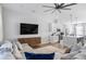 Open concept living and dining area with modern furnishings and stainless steel appliances at 6775 Pippin Walk, Alpharetta, GA 30005