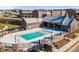 Upscale community pool featuring a spacious deck, covered lounge area, and stylish brick architecture at 6775 Pippin Walk, Alpharetta, GA 30005