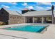 Inviting community pool with sun-drenched deck, covered lounge, and stylish brick detailing, perfect for relaxation at 6775 Pippin Walk, Alpharetta, GA 30005
