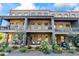 Charming two-story townhouse with brick facade, covered patios, and landscaped front yard at 6775 Pippin Walk, Alpharetta, GA 30005