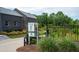 Community walking trail head with map and manicured entrance landscaping at 6775 Pippin Walk, Alpharetta, GA 30005